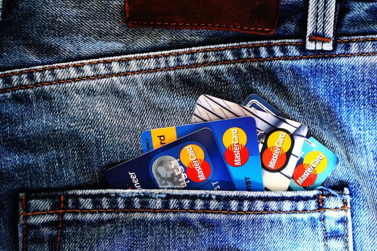 Credit cards arranged on denim fabric, representing credit score and financial health