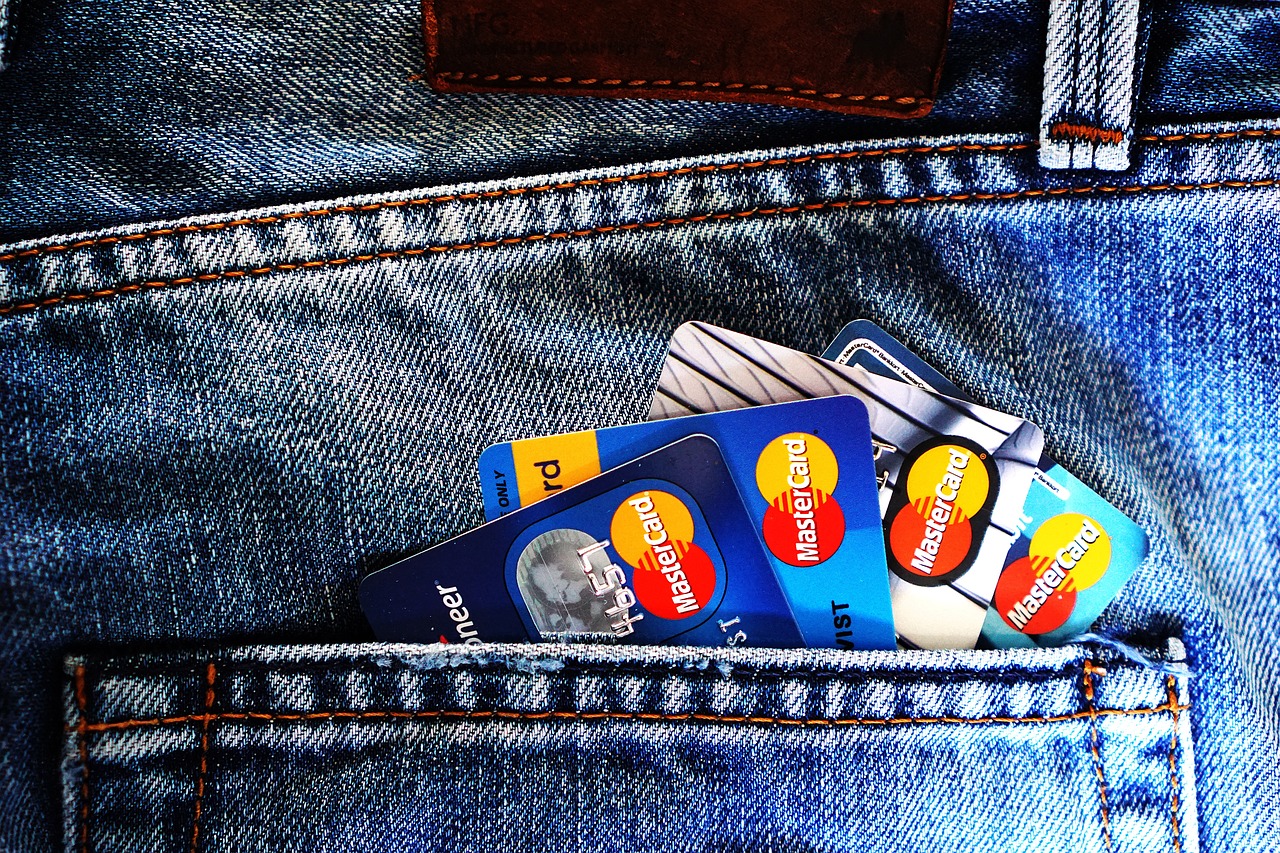 Credit cards arranged on denim fabric, representing credit score and financial health