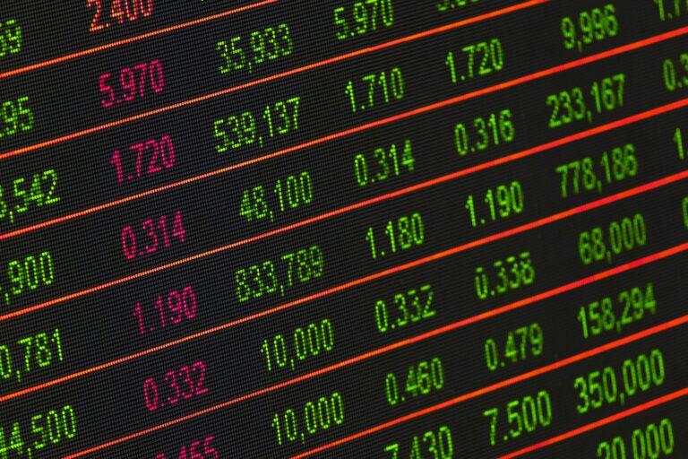 Stock exchange board showing colorful financial data and market trends