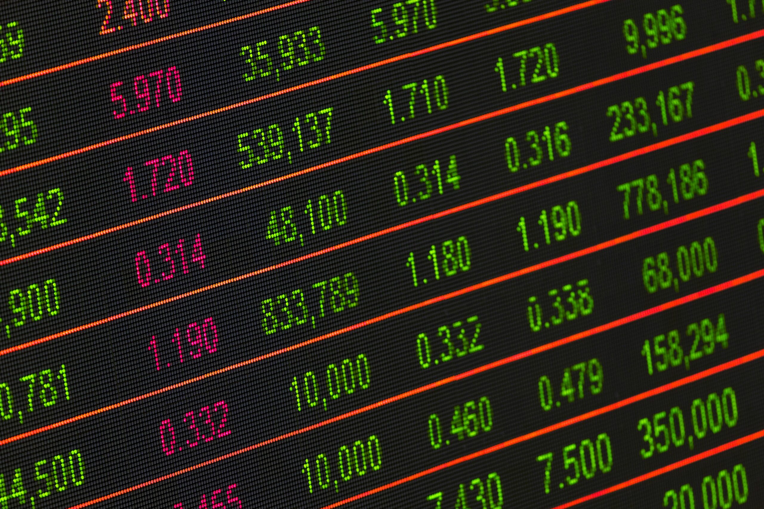 Stock exchange board showing colorful financial data and market trends