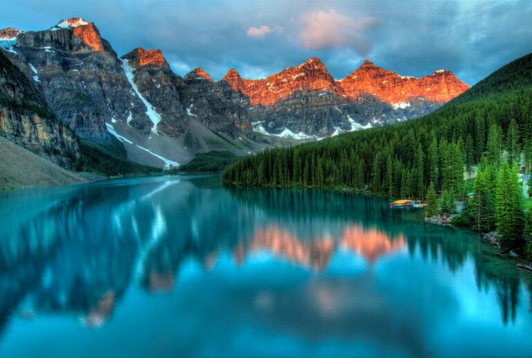 Scenic mountain landscape with calm lake at sunset