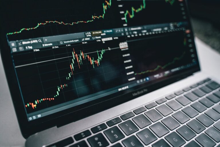 Financial graph on laptop screen depicting investment analysis