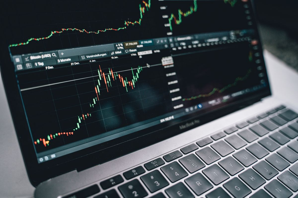 Financial graph on laptop screen depicting investment analysis